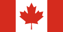 Description: A vertical triband design (red, white, red) with a red maple leaf in the center.